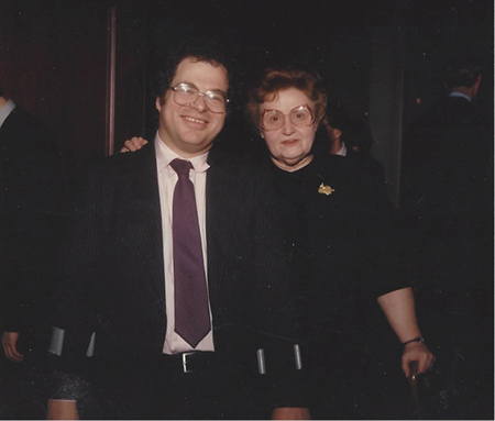 Dorothy DeLay on right with her hand on the shoulder of a smiling Itzhak Perlman.