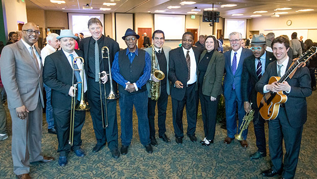 The MSU Professors of Jazz pose with Conrad Herwig and others at the MSUFCU Blue Mondays concert. image