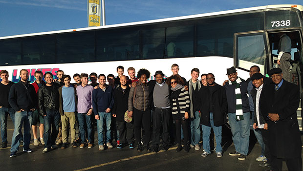 MSU jazz professors Randy Gelispie and Rodney Whitaker, pose with Christian McBride and students outside a tour bus. image