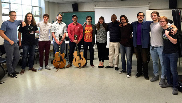 Russell Malone pauses for a group photo after a workshop with the MSU Jazz Guitar Studio. image