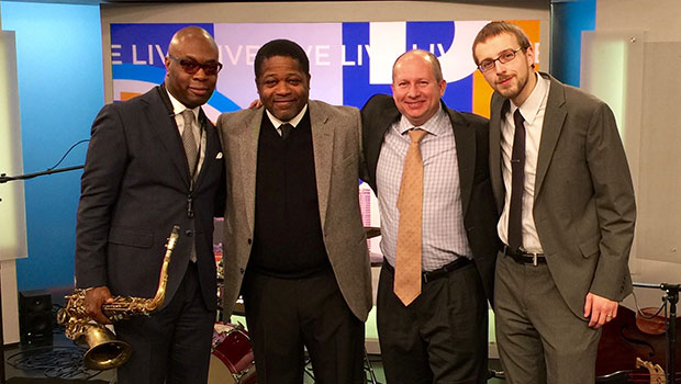 Tim Warfield, Jr. and Director of Jazz Studies Rodney Whitaker pose with Max Colley III and Corey Kendrick at WDIV studios in Detroit. image