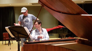 Two men at a piano 