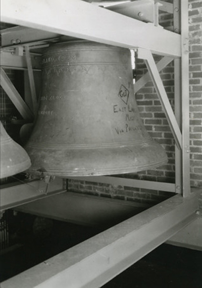 large bell hung in Beaumont Tower at Michigan State University, black and white