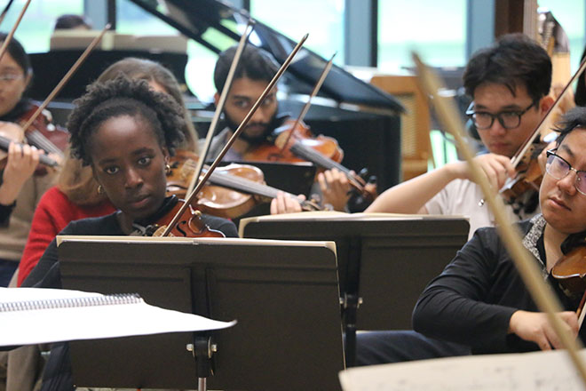 Students rehearse with the symphony orchestra