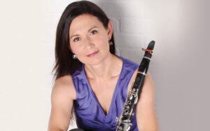 Headshot of Tasha Warren holding clarinet