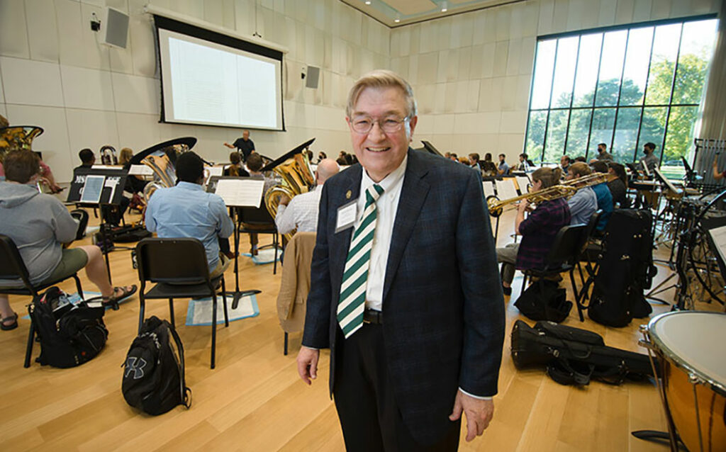 Dr. James K. Billman smiling in Billman Music Pavilion