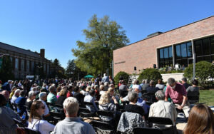 People sitting outside Billman Music Pavilion