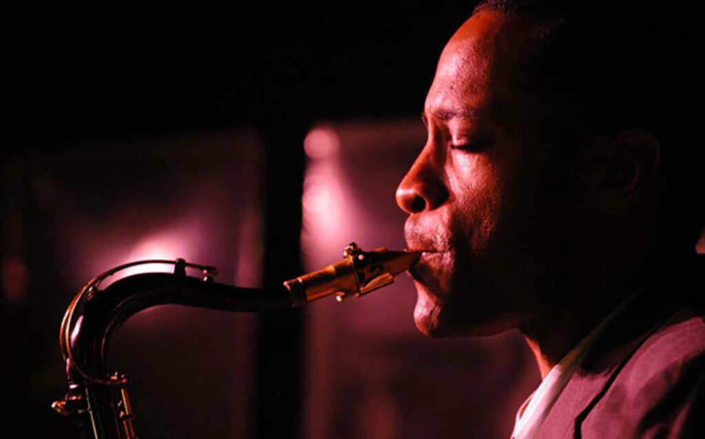 Side profile of Walter Blanding playing saxophone