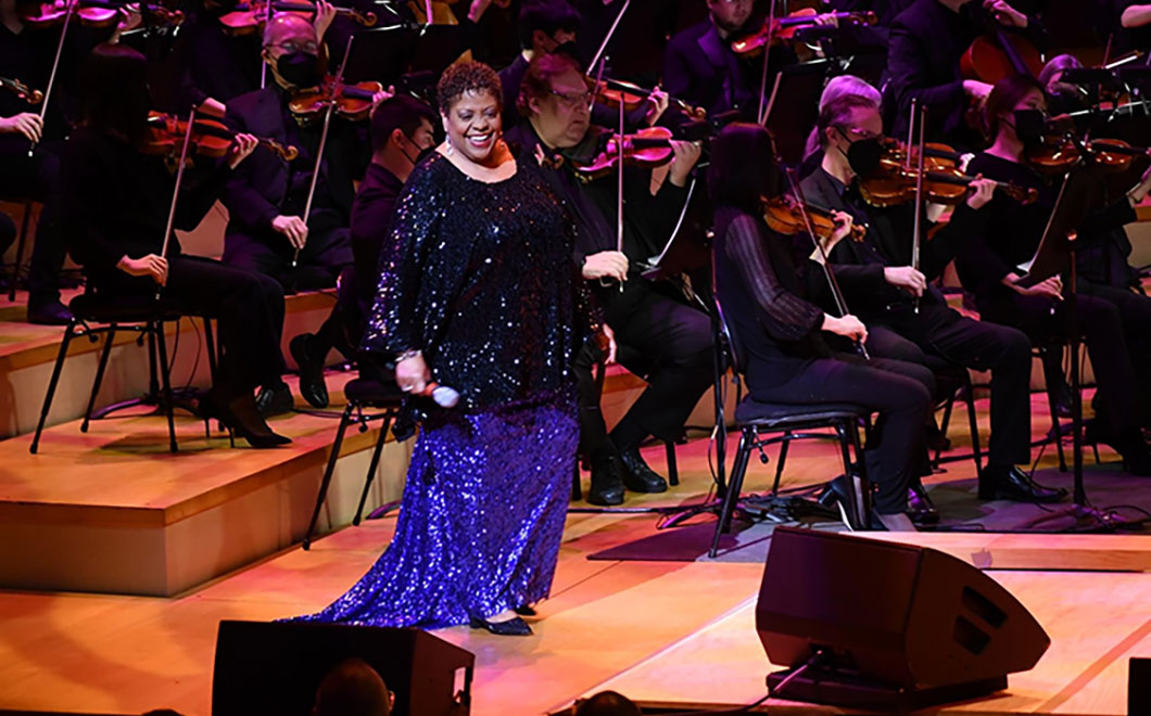 Carmen Bradford smiling at her audience