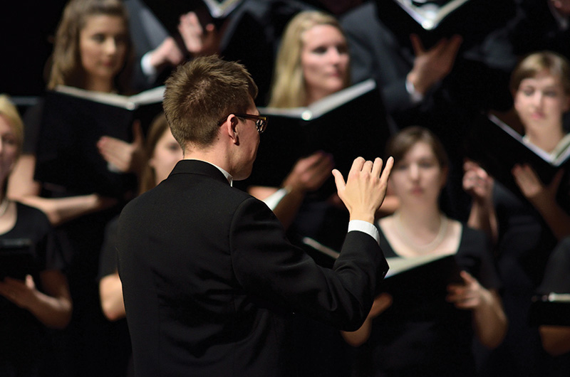 conductor conducts a choir