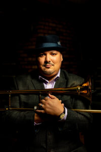 Photo of Michael Dease holding his trombone