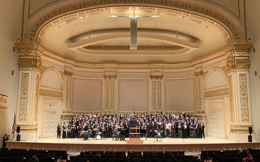 Choir performing onstage 