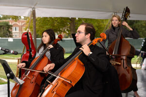 Side profile of man playing cello