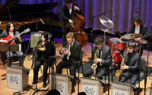 Jazz nonet players performing on stage