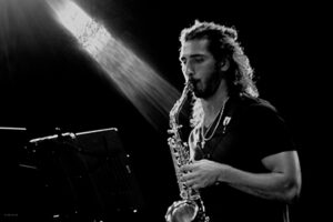 Black and white photo of Luke Haight playing saxophone 