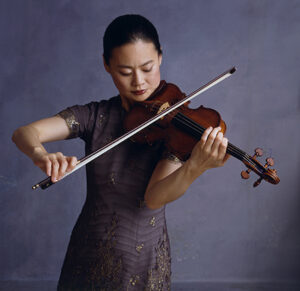 Professional photo of Midori playing violin