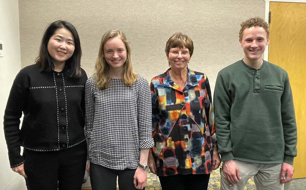 Four members of MSU students and faculty smiling