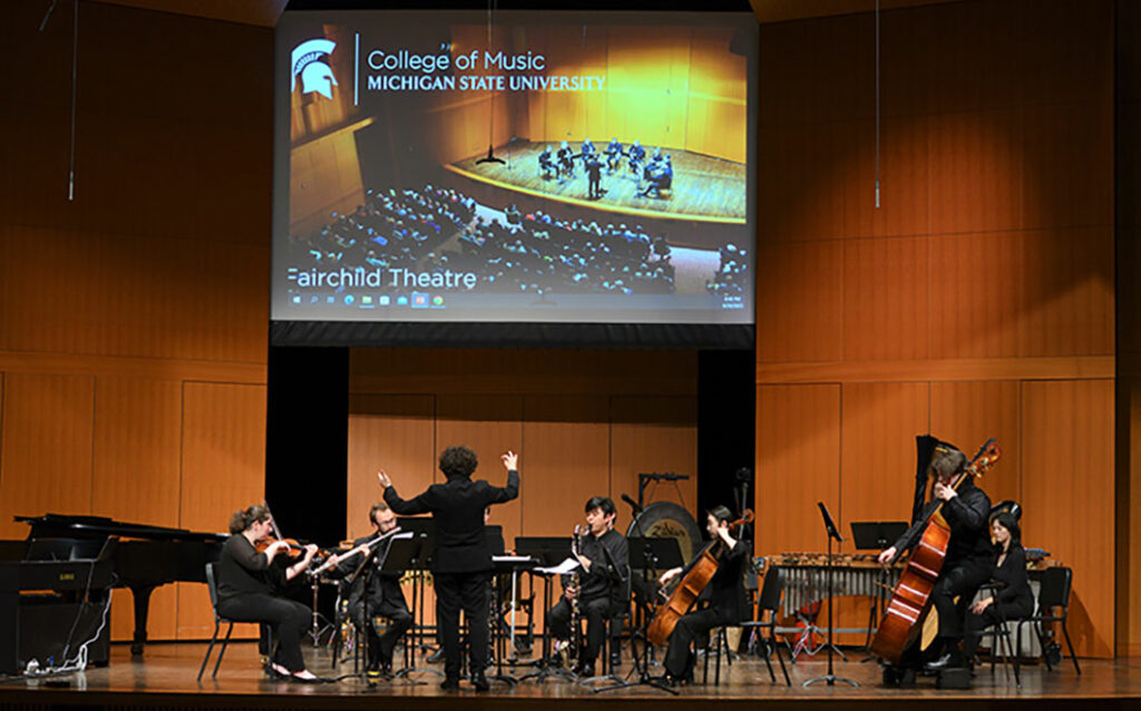 Photo of ensemble performing on stage 