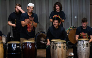 African Diaspora Percussion Ensemble performing on stage