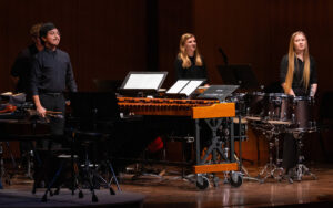 Percussion Ensemble taking bows on stage.