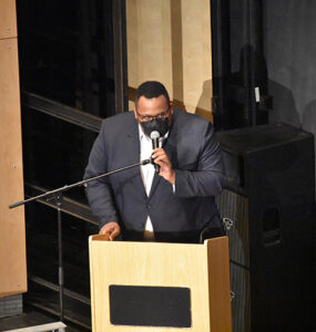 Kevin Day speaking at a podium 