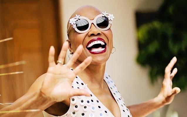 Dee Dee Bridgewater sports a huge smile and round sunglasses