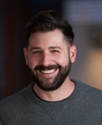 close up image of Phil DeTolve, a man whit dark hair and beard.