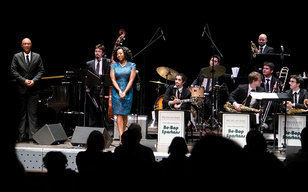 MSU Jazz musicians on stage while audience members give a standing ovation.