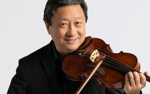 Portrait, Li-Kuo Chang, viola, smiling and looking at camera, holding violin in performance position
