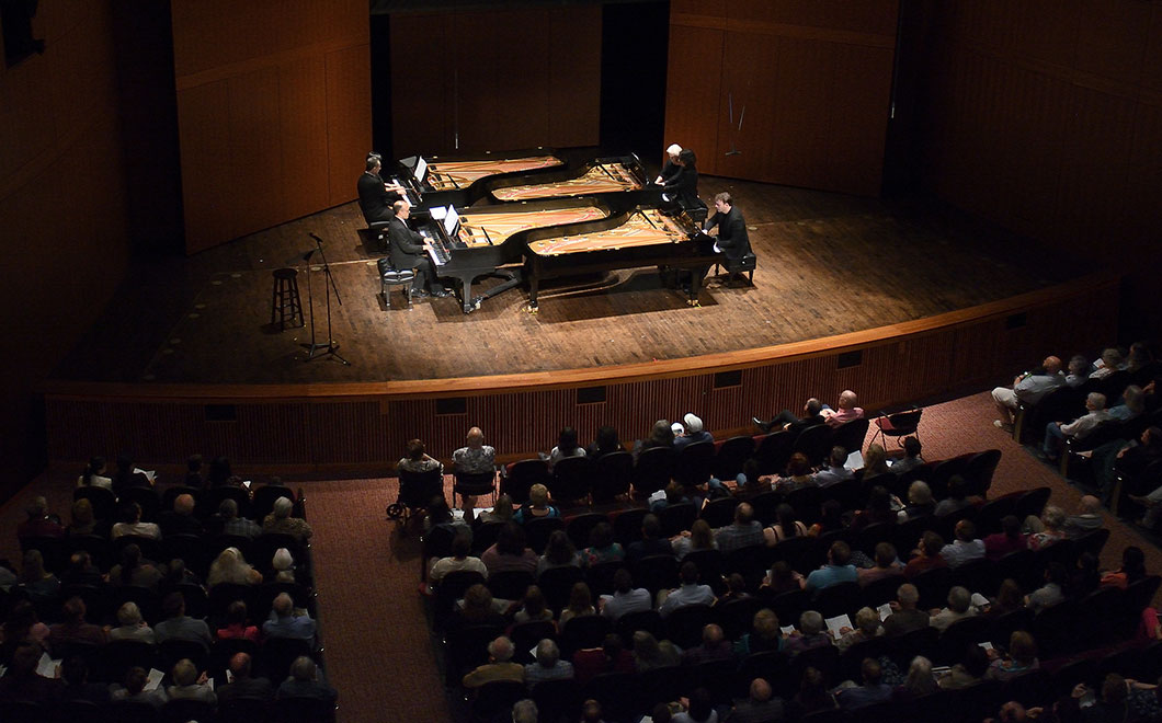 Four pianos onstage at Fairchild Theatre.