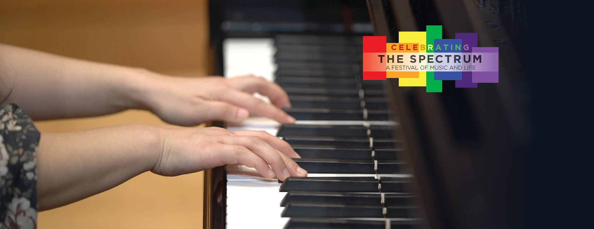 Photo: Close up of piano keys and pianists hand on the keys, performing. Logo in the upper right, 