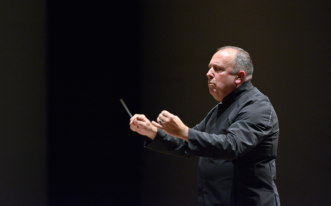 person conducting with a pointer