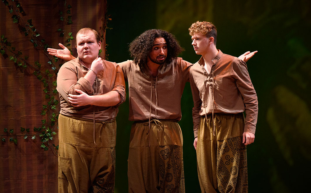 three actors in costume