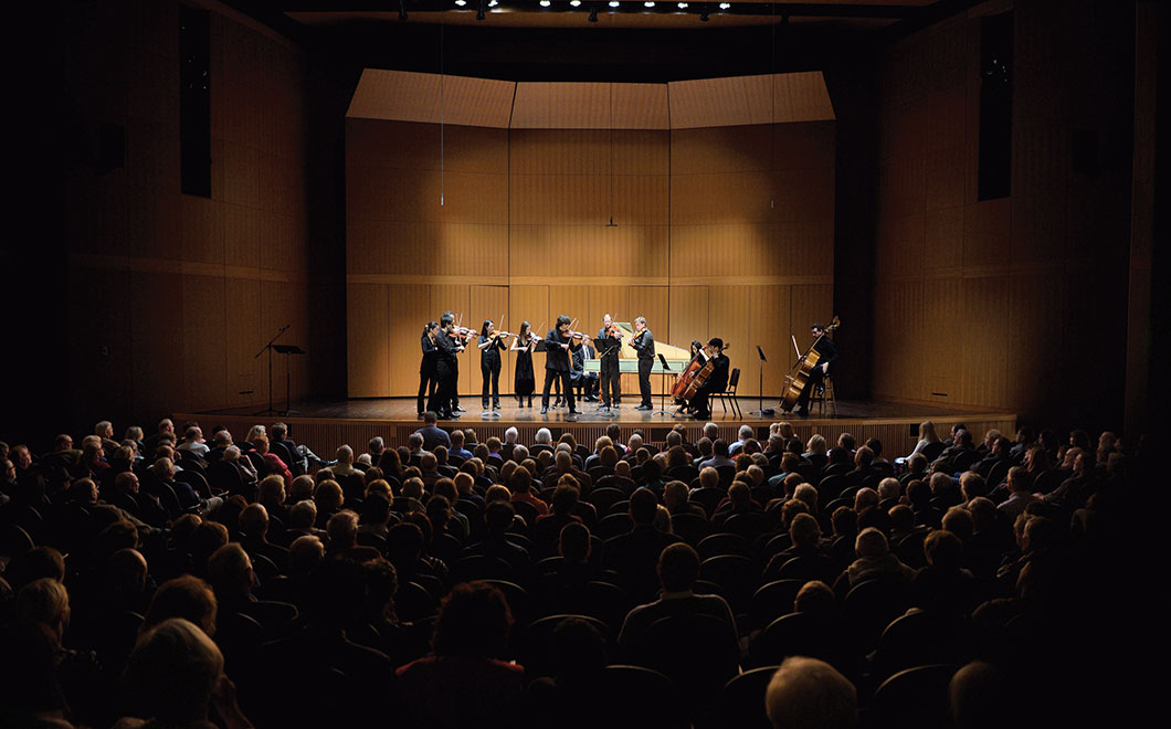 Small chamber orchestra, The International Chamber Soloists, led by violinist Dmitri Berlinsky, on concert stage, Fairchild Theatre, musicians performing