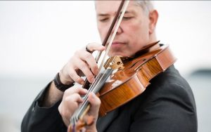 Closeup portrait of violist performing