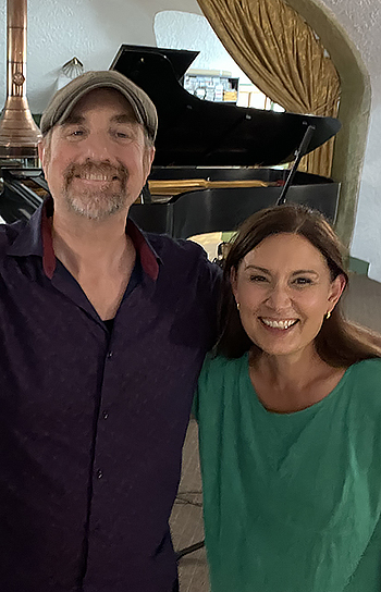 two people smiling close together