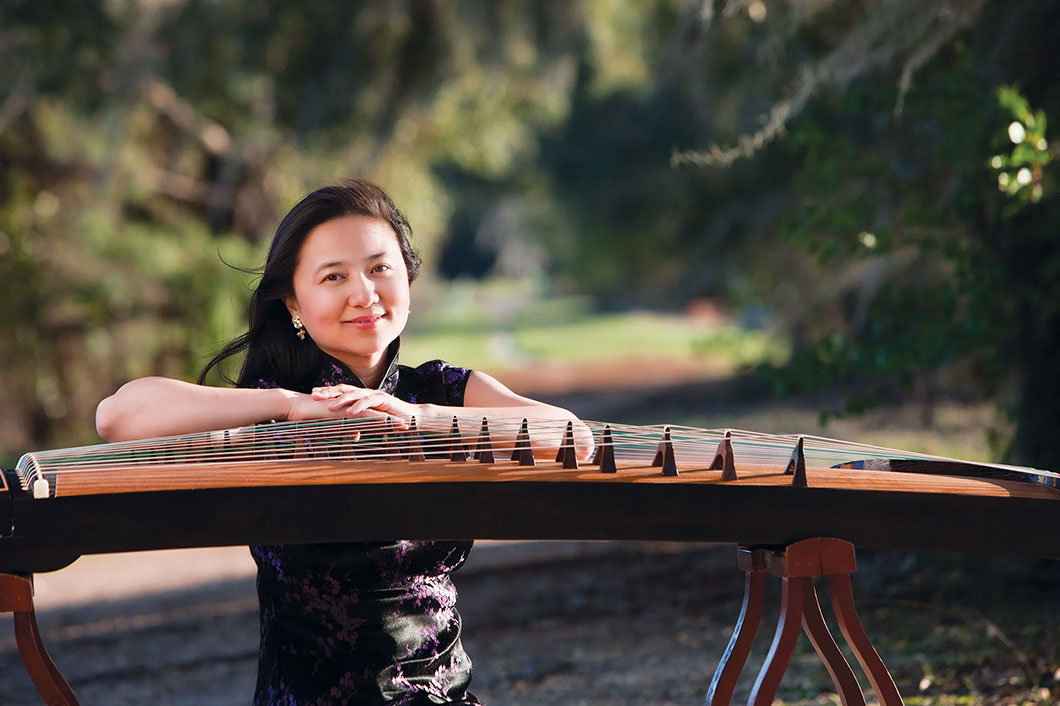 a musician with her Guzeng