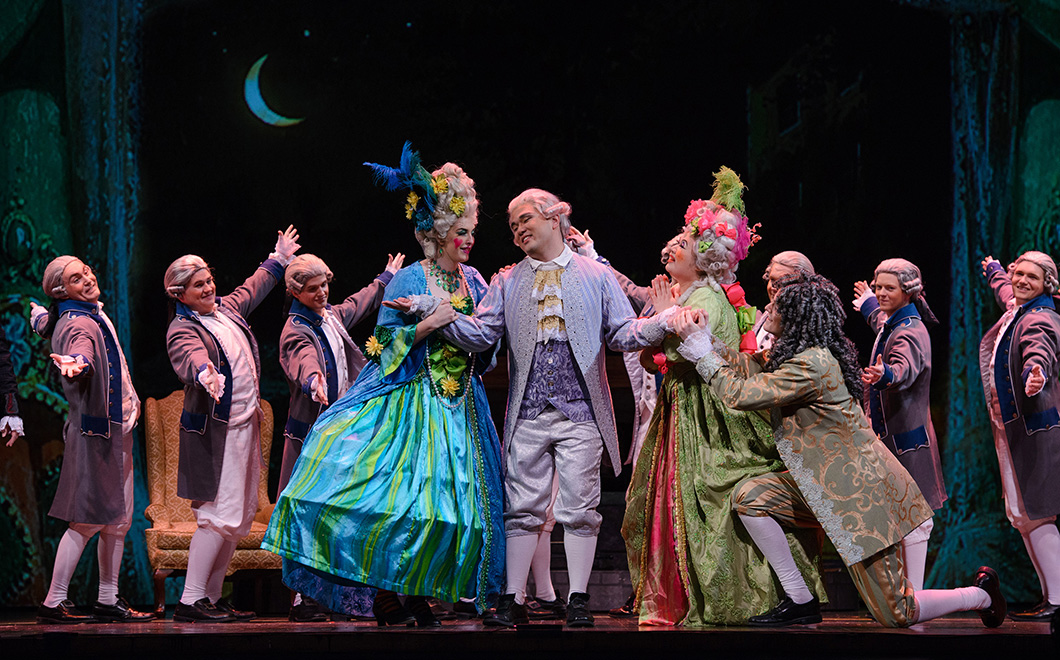 Opera performance depecting a ballroom gala and cast members in character