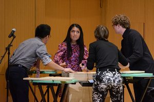 a percussion ensemble performs on stage