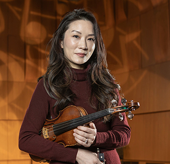 a person holding a violin