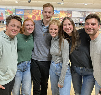 a group of six people smiling