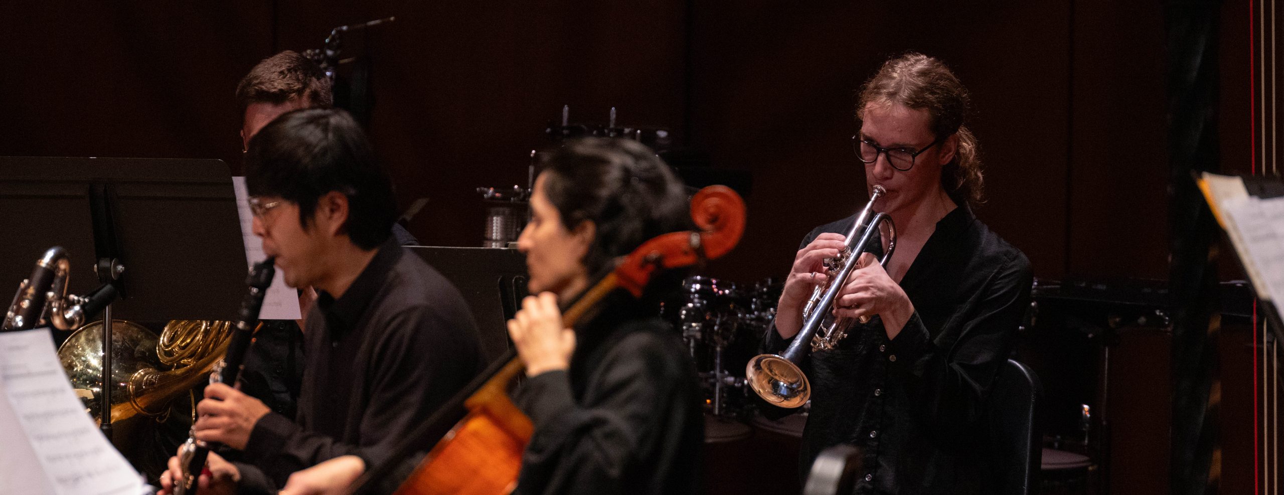 A variety of musicians are playing their instruments on stage.