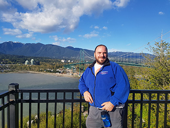 person standing on platform in front of expansive scenery