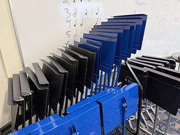 a stack of black and blue music stands