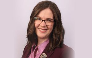 Photo portrait of visiting professor, smiling and looking at camera, Katherine Leo, from Millikin University