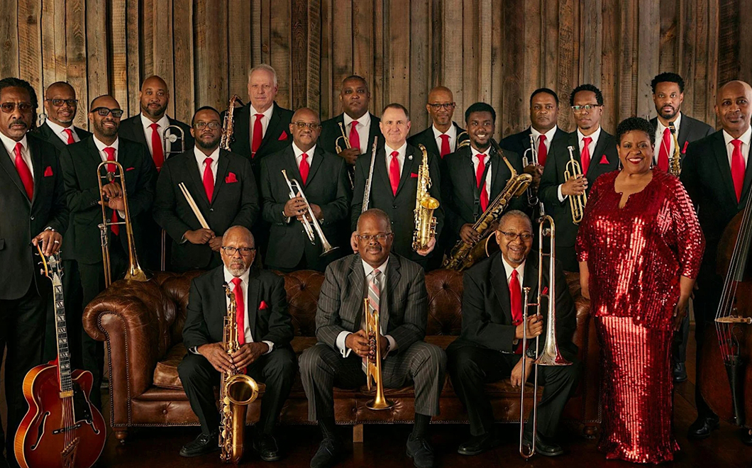 a large group of musicians holding musical instruments