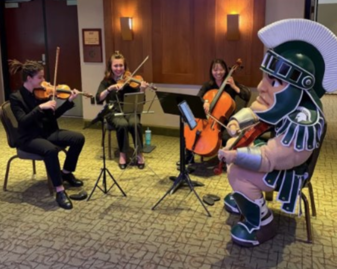 MSU mascot, Sparty, playing viola in a string quartet