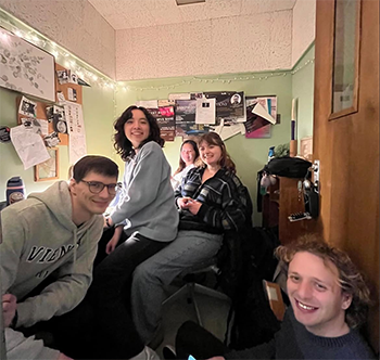 several people in a small musical room